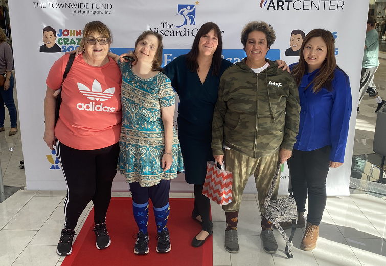 Louisa and Yonah pose with AHRC staff at John's Crazy Socks Fashion Show